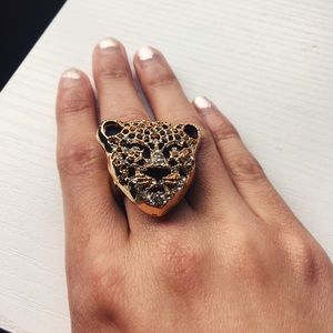 Gold, crystal, and black panther ring